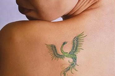 Dragon tattoo on back of shoulder