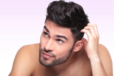Man with full head of hair promoting hair transplant